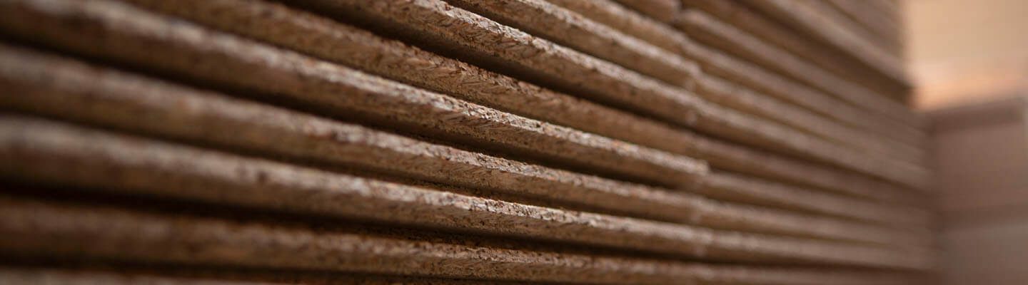 Close up of wooden boards stacked up